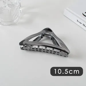 Close-up of a 10.5cm dark grey geometric triangle hair claw clip with a metallic finish