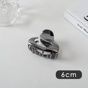Detail view of a 6cm gunmetal grey hair claw clip with a glossy metallic finish