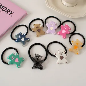 Eight-piece set of cartoon bear hair ties in various colors with heart design