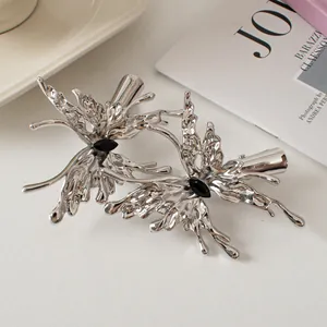 Silver liquid metal butterfly hair clips set with black gemstones in minimalist style