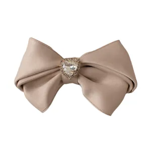 French vintage satin bow hair clip with a sparkling crystal heart in champagne gold