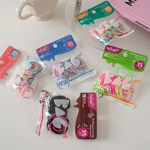 Detail showing assorted candy-colored elastic hair ties packed in 35-piece sets