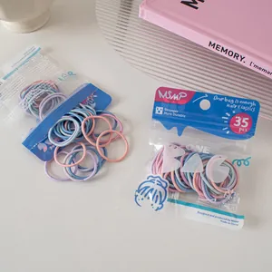 Detail view of MSMP candy-colored elastic hair ties in 35-piece transparent packaging