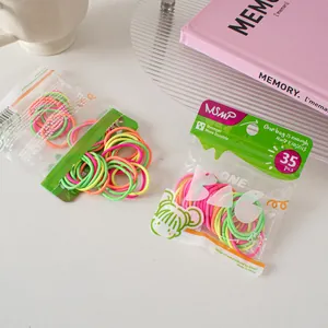 Detail of 35pcs pack candy colored elastic hair ties in transparent zip lock bag
