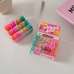 Close-up of rainbow high-elasticity baby hair ties in a premium branded gift box