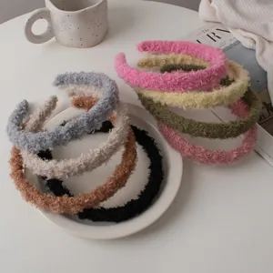 Close-up of diverse warm lamb wool headbands in autumn colors for winter styling