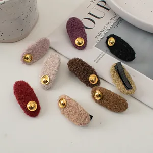 Retro lamb wool hair clips in various candy colors with gold accents for winter