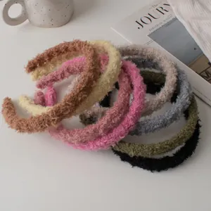 Macro shot of fluffy lamb wool headbands in various colors for autumn and winter fashion
