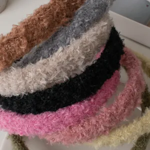 Close-up of colorful lamb wool headbands showing thick curly plush texture for autumn