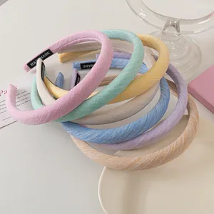 Detailed close-up of handmade fabric headbands showing textile texture and color variety