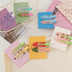 Close-up of summer fruit series seamless hair clips with pastel prints on display cards