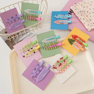 Detail showing colorful acrylic hair clips with fruit patterns in a decorative basket
