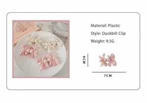 Detailed view of pink and cream bow hair clips with pearls on a decorative white plate