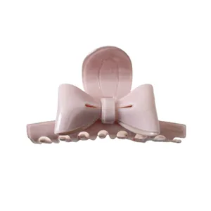 Pince à cheveux nœud rose en acétate avec gravure France handmade pour coiffure élégante