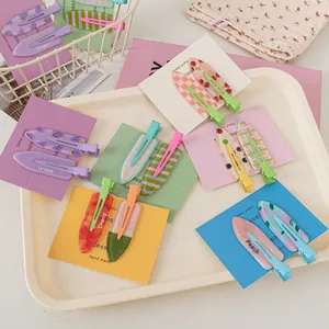 Close-up of summer fruit series seamless hair clips in colorful gift card packaging