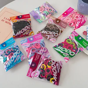 Detail of colorful high-elasticity baby hair ties packed in various assorted clear pouches