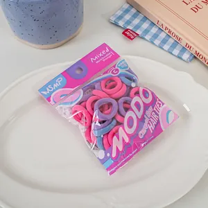 Pink and purple high-elasticity baby size hair ties in MODO brand retail packaging