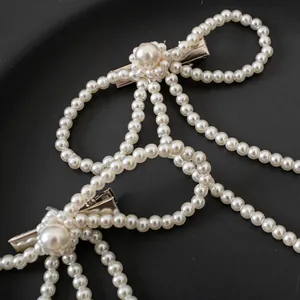 Elegante Haarklammern mit Perlenbogen und Quasten-Anhängern im französischen Stil