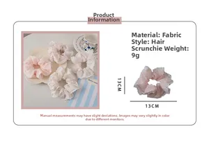 Detail of pink polka dot scrunchie with white lace trim showing 13cm diameter size