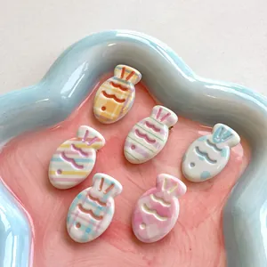 Cute set of 6 fish-shaped macaron hair clips with pastel patterns in a blue cloud tray