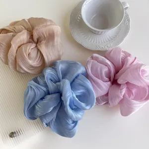 Elegant large pearl yarn scrunchies in champagne, light blue and pink colors