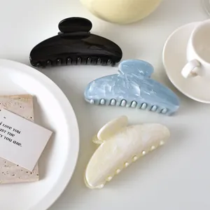 Minimalist marble pattern semi-circular hair claw clips in black, blue and white colors