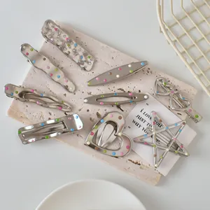 Set of 8 silver metal hair clips with colorful dots in star heart and wave shapes