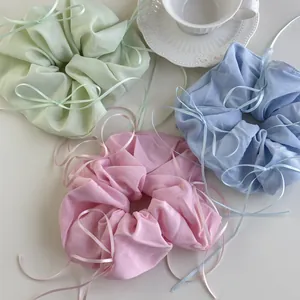 French style satin scrunchies with ribbons in pastel pink, green, and blue colors