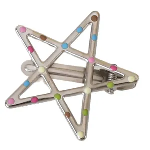 Y2K star hair clip in silver metal with colorful polka dots on a white background