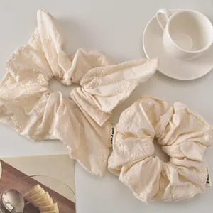 Floral embroidered cream scrunchies and bow hair ties set with refined cotton texture