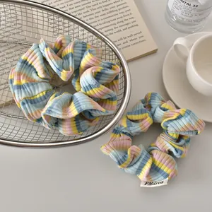 Blue and pink striped knit scrunchies set with soft ribbed texture and brand label