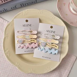 Pastel wave plaid and floral hair clip set for girls on a decorative display card