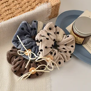 Three-piece velvet polka dot hair scrunchies with lace trim and handmade wooden button