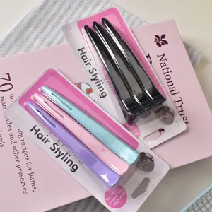 Detail of 12cm hair clips set in black and pastel colors for styling and sectioning