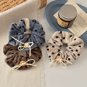 Three-piece velvet polka dot hair scrunchies with lace, wooden buttons and bows