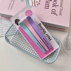 Detailed view of 12cm professional long hair clips in various pastel colors and packaging