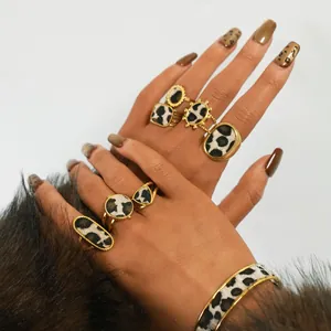 Retro leopard print jewelry set with gold metal rings and horsehair cuff bracelet for women