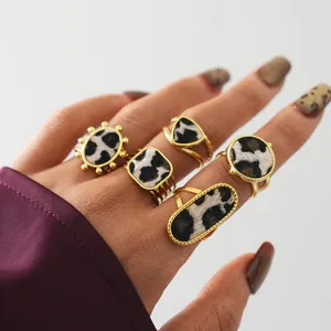 Vintage gold ring set featuring faux pony hair with black and white animal print patterns