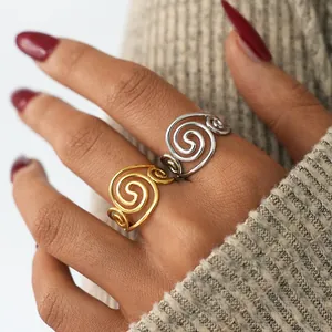 Luxurious gold and silver stainless steel swirl rings with elegant spiral design