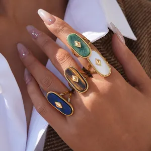 Vintage oval shell and stone rings in gold finish with geometric stud accents