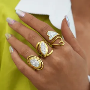 Three-piece gold plated stainless steel ring set with heart and oval crystal designs