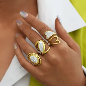 Chic set of three gold titanium rings featuring white zircon stones in bohemian style