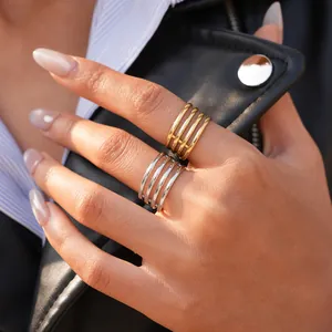 Detail of minimalist multi-layer hollow rings in gold and silver finish for women