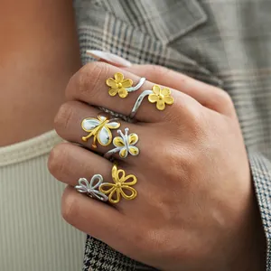 Three-piece adjustable ring set featuring floral and butterfly motifs in gold and silver