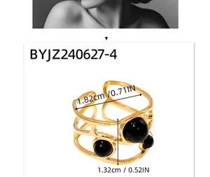 Detail view of 18k gold plated stainless steel ring with three black gemstones and dimensions