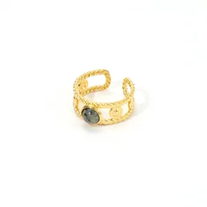 Detail of vintage gold-plated ring with twisted rope texture and green natural stone