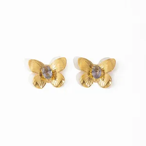 Boucles d'oreilles papillon en or 18K avec pierres violettes et ailes texturées