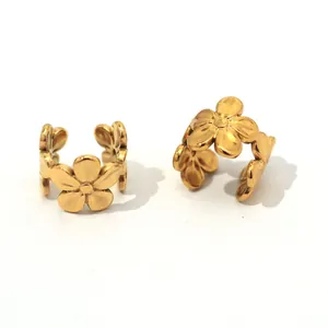 Elegant gold flower ear cuffs in stainless steel featuring a minimalist floral design