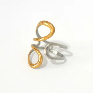 Minimalist geometric overlapping stainless steel ring with gold and silver polished finish