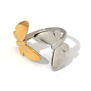 Minimalist adjustable open bangle with polished gold and silver butterfly motifs